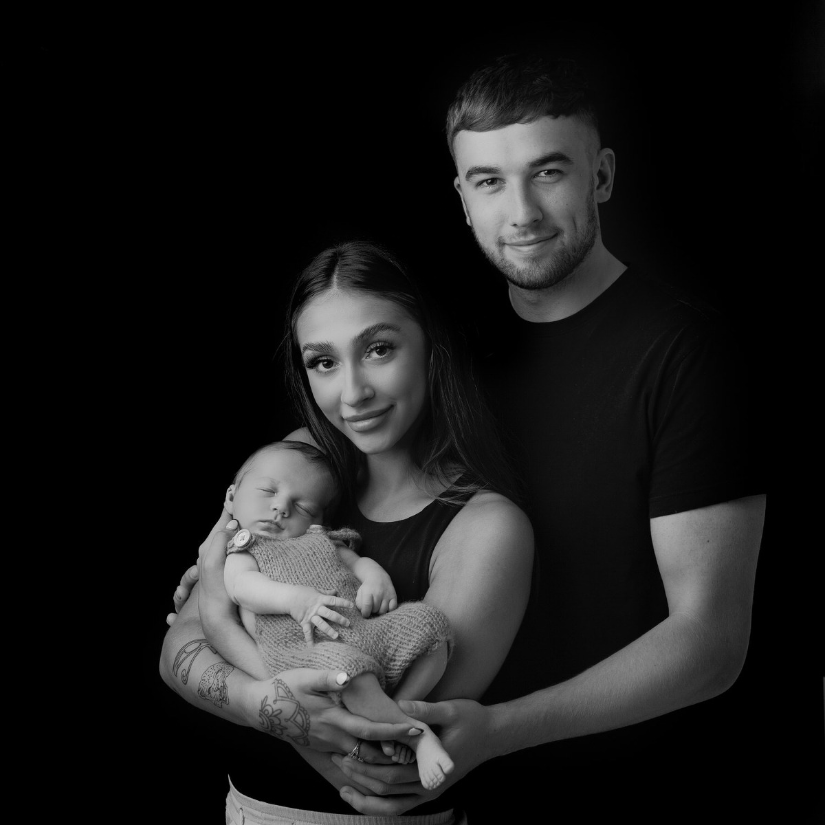 family with newborn baby photographed in black and white by Melanie East Photography Bristol natural newborn photographer